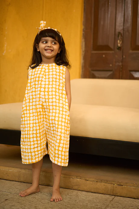‘Innocence’ kids jumpsuit in yellow polka hand block print cotton for boys and girls