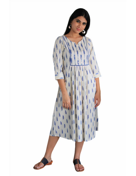 White ikat dress with embroidered yoke and front pockets