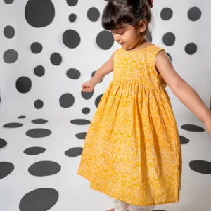 Set of 2- 'Love, share and care' yellow cotton kurta with floral hand block-print with white dhoti pant