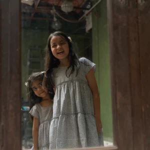 'Twirl’ girls short sleeve tiered dress in grey hand block print cotton