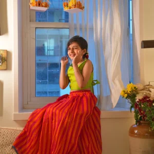 Palash girls ethnic wear set with lime green choli and orange pink striped skirt in handwoven cotton silk