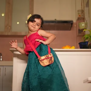 Dahlia girls ethnic wear set with pink blouse and green lehenga skirt in handwoven cotton silk with an upcycled handmade bag